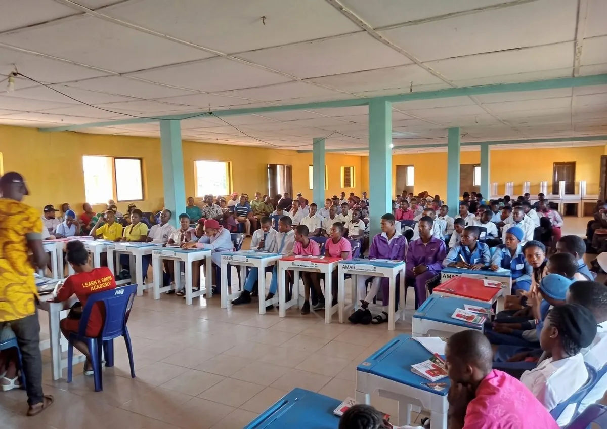 Isiala Mbano Secondary School quiz competition with students in a hall